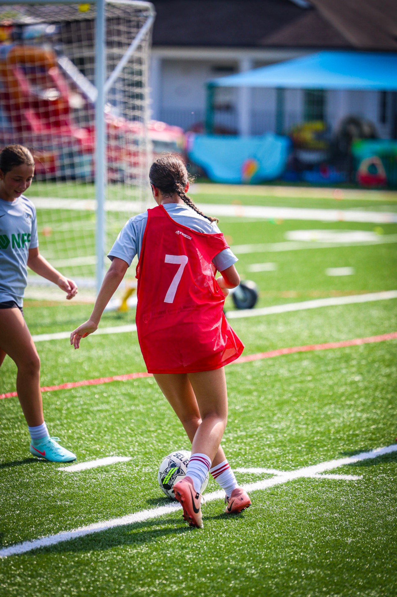 Young soccer player dribbling